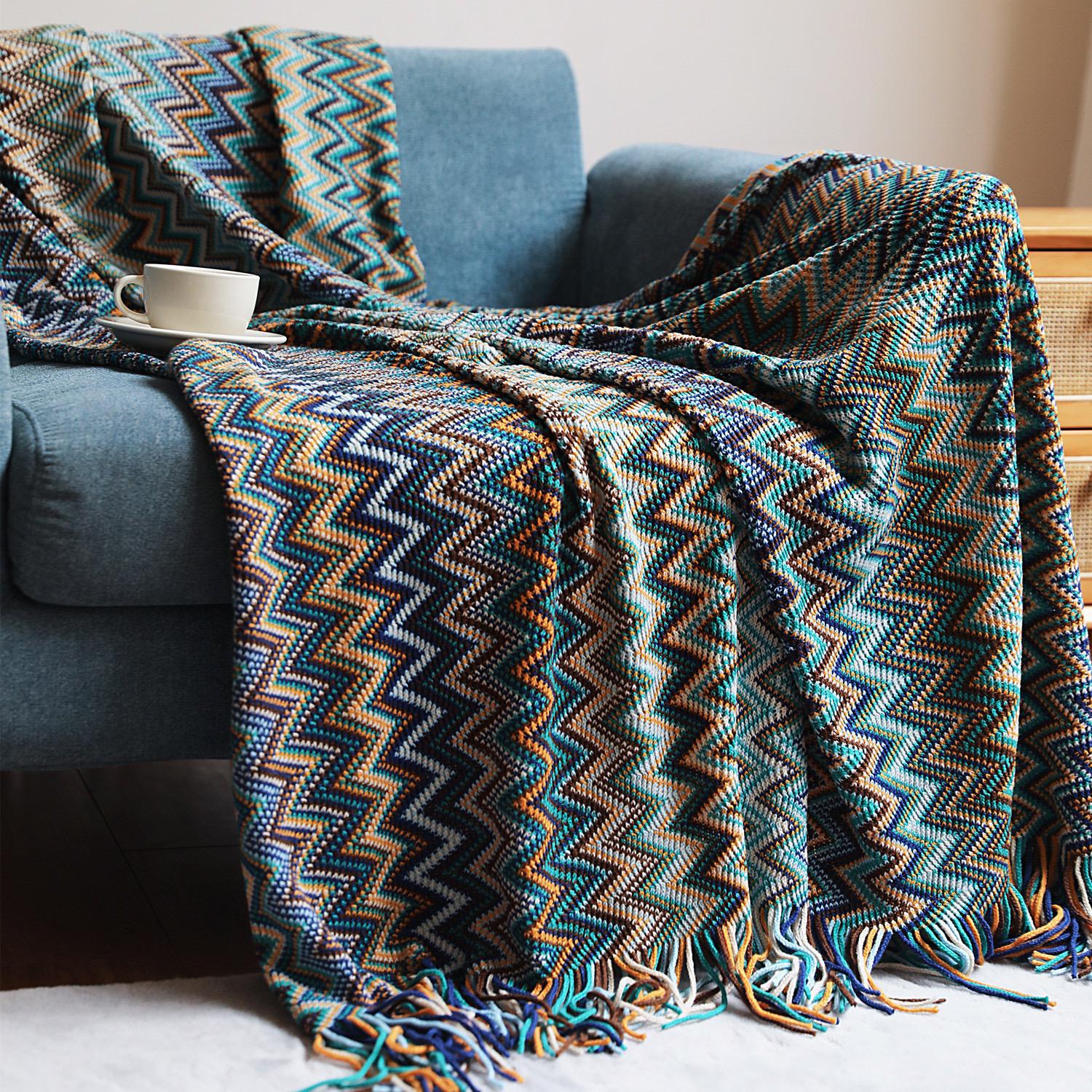 Multicolor bohemian knitted throw blanket with tassels.