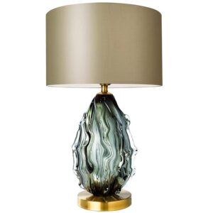 Modern green glass table lamp with a taupe fabric shade.