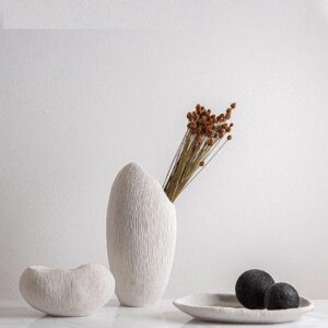 Modern white resin vase and tray set with a coral texture.